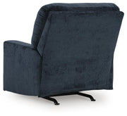 Ashley Furniture Aviemore recliner with plush upholstery and padded armrests, shown from the back in a comfortable living room setting.