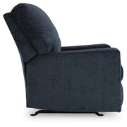 Ashley Furniture Aviemore recliner with plush fabric and padded armrests, shown in a side view.