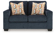 Ashley Furniture Aviemore loveseat with plush cushions and soft upholstery, shown from a head-on view.