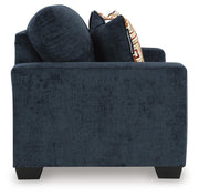 Ashley Furniture Aviemore loveseat showing plush fabric upholstery and cushioned seats in a cozy living room setting.