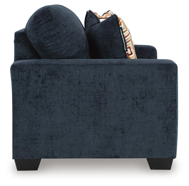 Ashley Furniture Aviemore loveseat showing plush fabric upholstery and cushioned seats in a cozy living room setting.