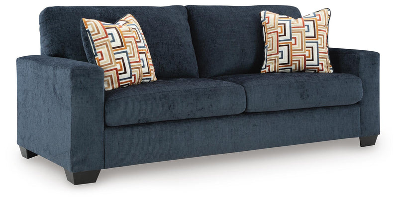Ashley Furniture Aviemore Sofa Sleeper with plush fabric, angled view showing the sofa with a pull-out bed feature.