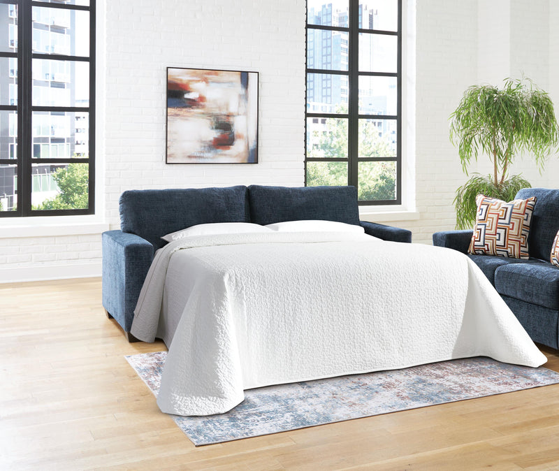Ashley Furniture Aviemore Sleeper Sofa with plush fabric and fold-out bed in a modern living room setting.
