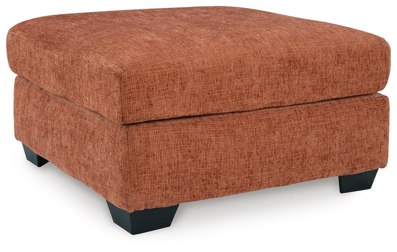 Ashley Furniture Aviemore oversized accent ottoman with plush fabric and a modern design, shown from an angled view.