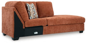 Ashley Furniture Aviemore sectional with chaise, featuring plush cushions and a modern design, shown from an angled view.