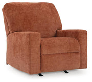 Ashley Furniture Aviemore recliner in dark brown fabric, showing a close-up side view with plush cushioning and a reclined position.