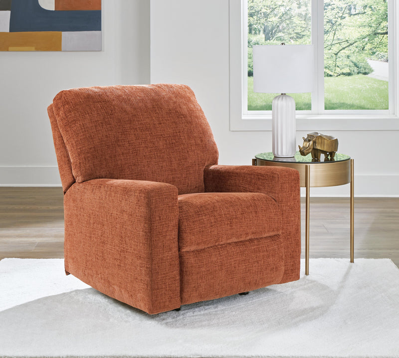 Ashley Furniture Aviemore recliner in dark brown leather with plush cushioning and wide armrests, shown with closed reclining mechanism.