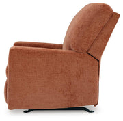 Ashley Furniture Aviemore recliner with plush upholstery and padded armrests, shown from the side view.