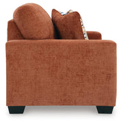 Aviemore loveseat by Ashley Furniture showing plush fabric upholstery and comfortable armrests in a cozy living room setting.