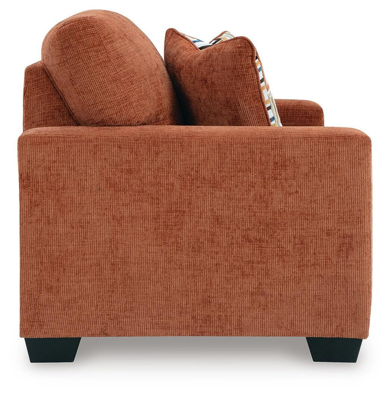 Aviemore loveseat by Ashley Furniture showing plush fabric upholstery and comfortable armrests in a cozy living room setting.