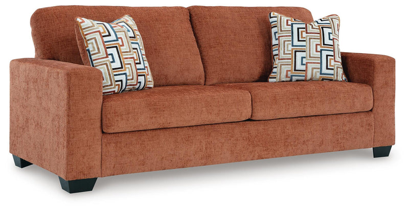 Ashley Furniture Aviemore sofa sleeper with plush fabric, angled view showing its convertible sleeper feature and modern design.
