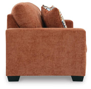 Ashley Furniture Aviemore sleeper sofa with plush fabric, shown with open bed and side view in a modern living room setting.