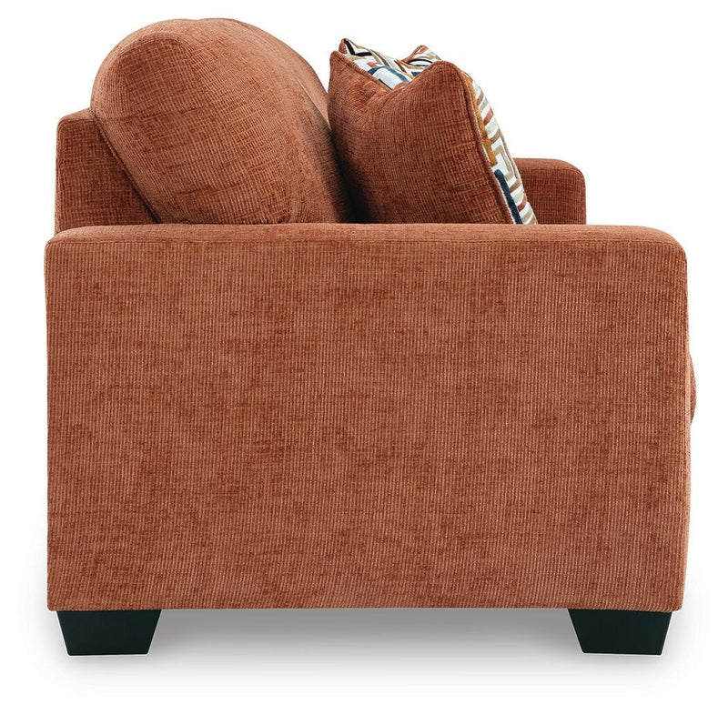 Ashley Furniture Aviemore sleeper sofa with plush fabric, shown with open bed and side view in a modern living room setting.