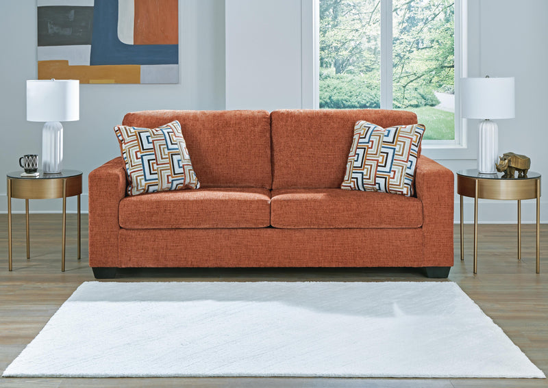 Ashley Furniture Aviemore Sofa Sleeper with plush fabric, featuring a fold-out bed and modern design in a cozy living room setting.