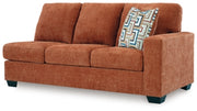 Ashley Furniture Aviemore sectional with chaise, featuring plush upholstery and modern design, shown from an angled side view.