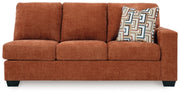 Ashley Furniture Aviemore sectional with chaise showing plush fabric, wide armrests, and modern design from a head-on view.