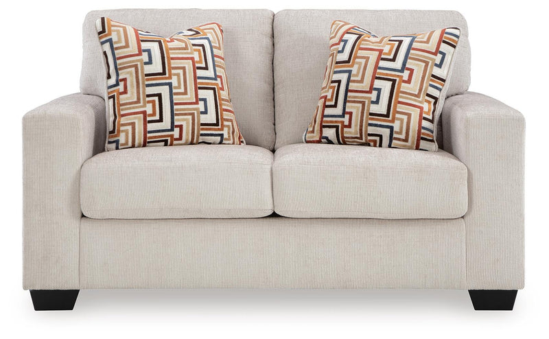Ashley Furniture Aviemore loveseat with plush upholstery, two cushions, and wooden legs, shown from a head-on angle.