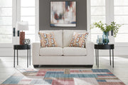 Ashley Furniture Aviemore loveseat with plush fabric and cushioned arms, shown in a cozy living room setting.
