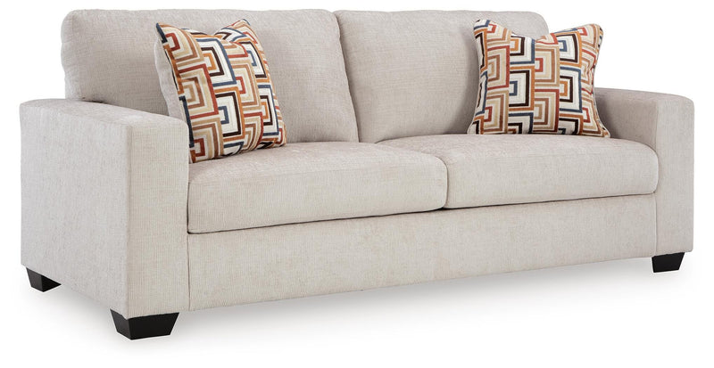 Ashley Furniture Aviemore Sofa Sleeper with plush fabric, showing the sofa in a folded and open sleeping position in a modern living room setting.