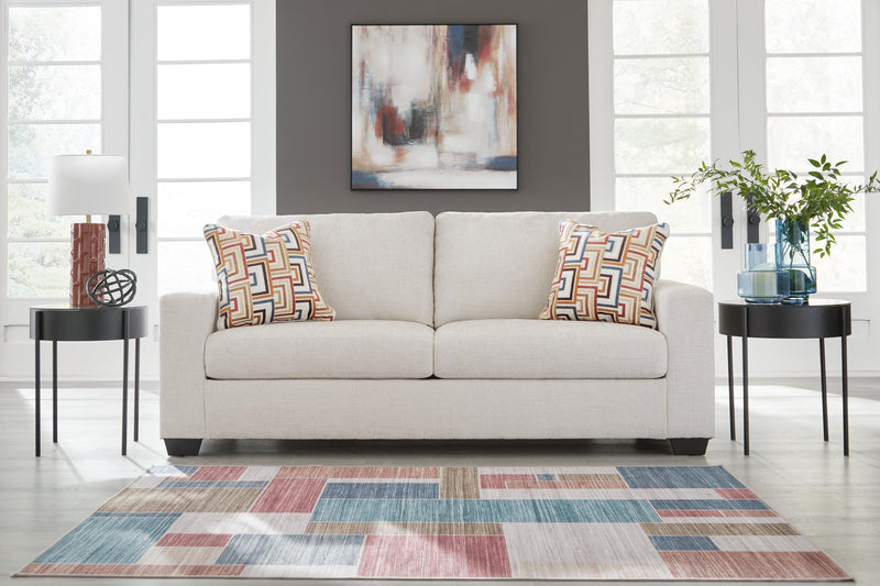 Ashley Furniture Aviemore Sofa Sleeper with plush fabric, featuring a fold-out bed and modern design in a neutral color.