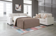 Ashley Furniture Aviemore Sofa Sleeper with plush fabric and convertible design, shown in a cozy living room setting.