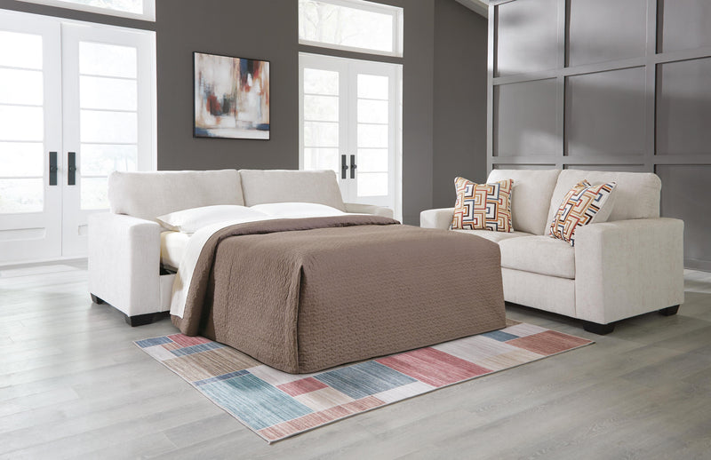 Ashley Furniture Aviemore Sofa Sleeper with plush fabric and convertible design, shown in a cozy living room setting.