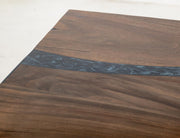 Rectangular dining table by International Furniture Direct with a wooden finish, showcasing a sturdy design for modern dining rooms.