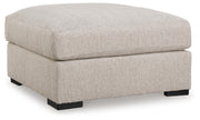 Ashley Furniture Ballyton upholstery living room set, angled view of sofa and loveseat in neutral fabric.