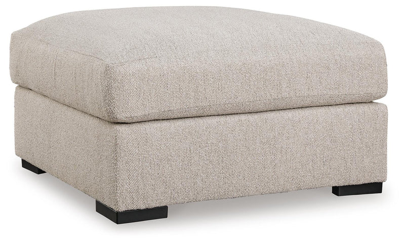 Ashley Furniture Ballyton upholstery living room set, angled view of sofa and loveseat in neutral fabric.