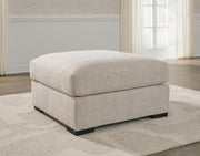 Ashley Furniture Ballyton upholstery living room set with plush fabric cushions and dark wooden legs, shown in a modern living space.