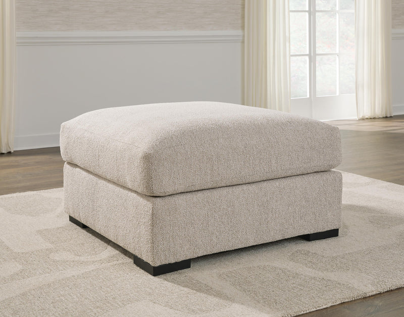 Ashley Furniture Ballyton upholstery living room set with plush fabric cushions and dark wooden legs, shown in a modern living space.