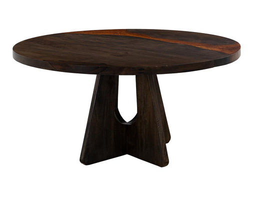 Round Raramuri dining table by International Furniture Direct with a wooden finish and sturdy legs, suitable for family meals.