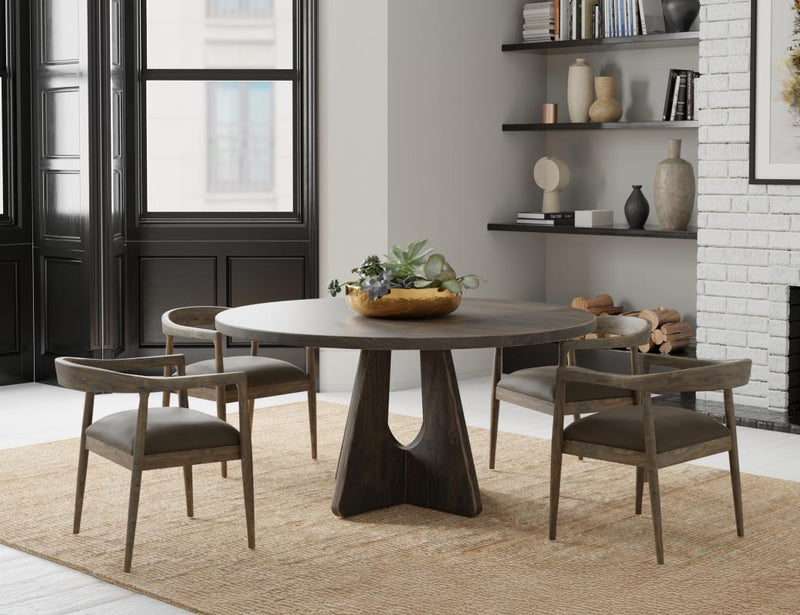 Black Balam round dining table by International Furniture Direct, 47 inches in diameter, with a smooth tabletop and sturdy base.