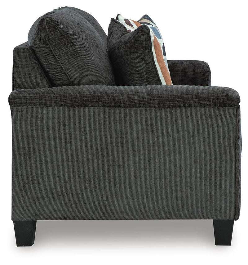 Ashley Furniture Erinslane sofa with plush fabric and modern design, shown in a stylish living room setting.