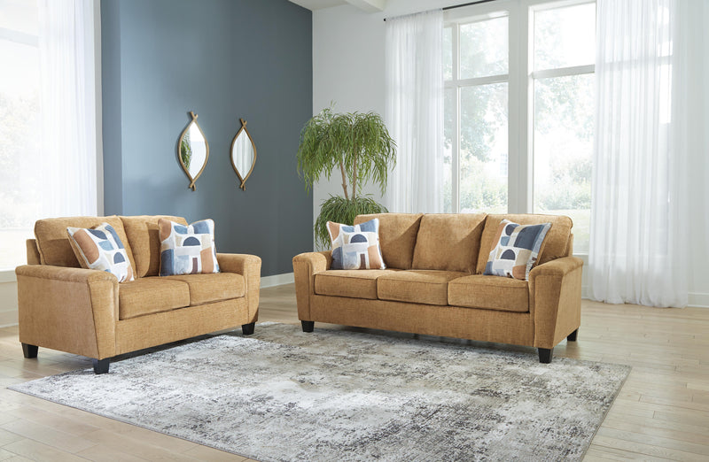 Ashley Furniture Erinslane living room set featuring a sofa and loveseat with neutral upholstery and wooden legs.
