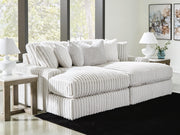 Ashley Furniture Stupendous Super Chaise sectional with plush cushions and modern design, shown in a cozy living room setting.