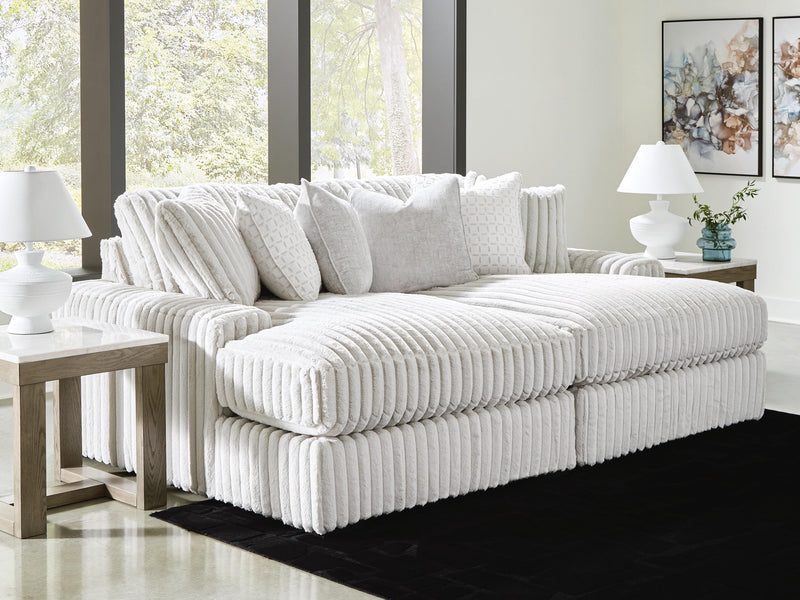 Ashley Furniture Stupendous Super Chaise sectional with plush cushions and modern design, shown in a cozy living room setting.