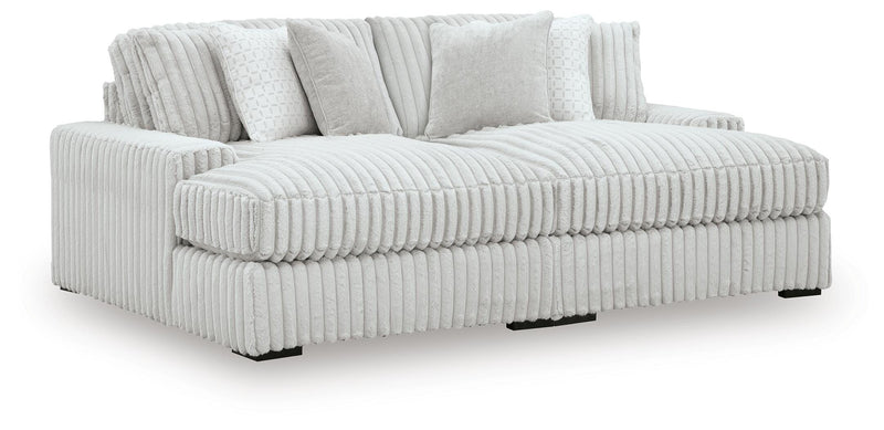 Ashley Furniture Stupendous Super Chaise sectional with plush cushions and modern design, shown from an angled perspective.