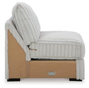 Ashley Furniture Stupendous Sectional sofa with plush cushions and a modern design, shown in a cozy living room setting.
