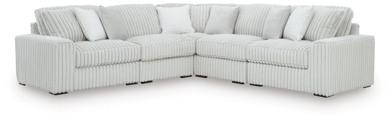 Ashley Furniture Stupendous sectional with plush fabric, featuring a modern L-shaped design and multiple cushions for comfort.