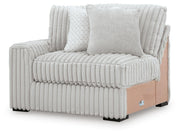 Ashley Furniture Stupendous sectional sofa with plush cushions and modern design, shown from an angled perspective.