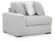 Ashley Furniture Stupendous Sectional sofa with plush cushions and modern design, shown from an angled view.