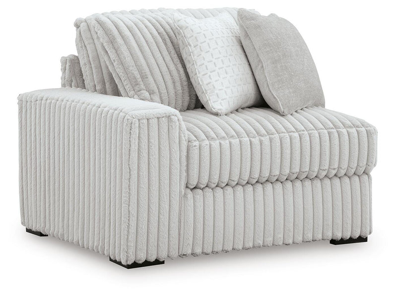 Ashley Furniture Stupendous Sectional sofa with plush cushions and modern design, shown from an angled view.