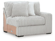 Ashley Furniture Stupendous sectional sofa with plush cushions and modern design, shown from an angled view.