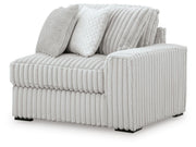 Ashley Furniture Stupendous sectional sofa shown from an angled view, featuring plush cushions and modern design.
