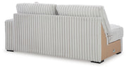 Ashley Furniture Stupendous sectional sofa with plush cushions and modern design, shown from the back view.
