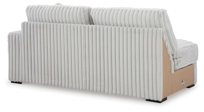 Ashley Furniture Stupendous sectional sofa with plush cushions and modern design, shown from the back view.