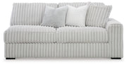 Ashley Furniture Stupendous sectional sofa with plush cushions and modern design, shown from a head-on view.
