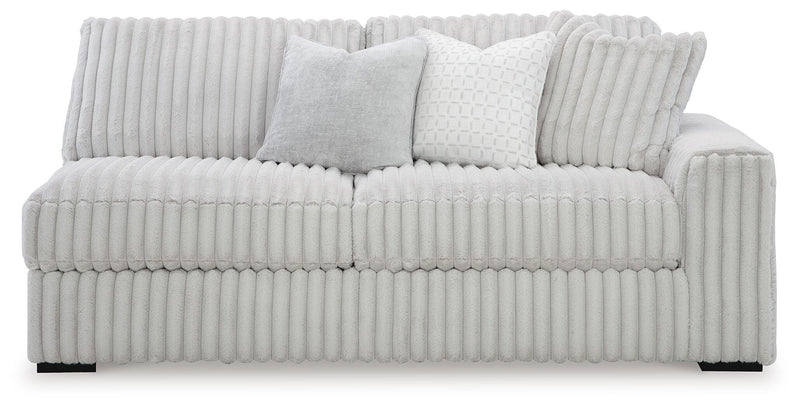 Ashley Furniture Stupendous sectional sofa with plush cushions and modern design, shown from a head-on view.