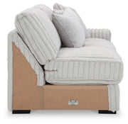 Ashley Furniture Stupendous sectional sofa with plush cushions and modern design, showing the side view of the sectional.